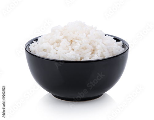 Fotomural rice in black bowl on white background