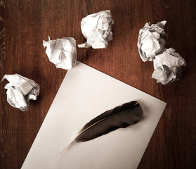 Wall Mural - still life of paper and a crumpled paper on a table with a pen