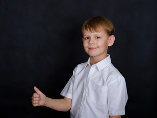 Wall Mural - European boy with a gesture like