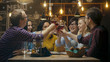 © Gorodenkoff - Diverse Group of Friends Celebrate with a Toast and Clink Raised Wine Glasses in Celebration. Beautiful Young People Have Fun in the Stylish Bar/ Restaurant.