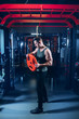 © Dmitriy Shipilov - muscular sportsman at the gym holding barbell weight