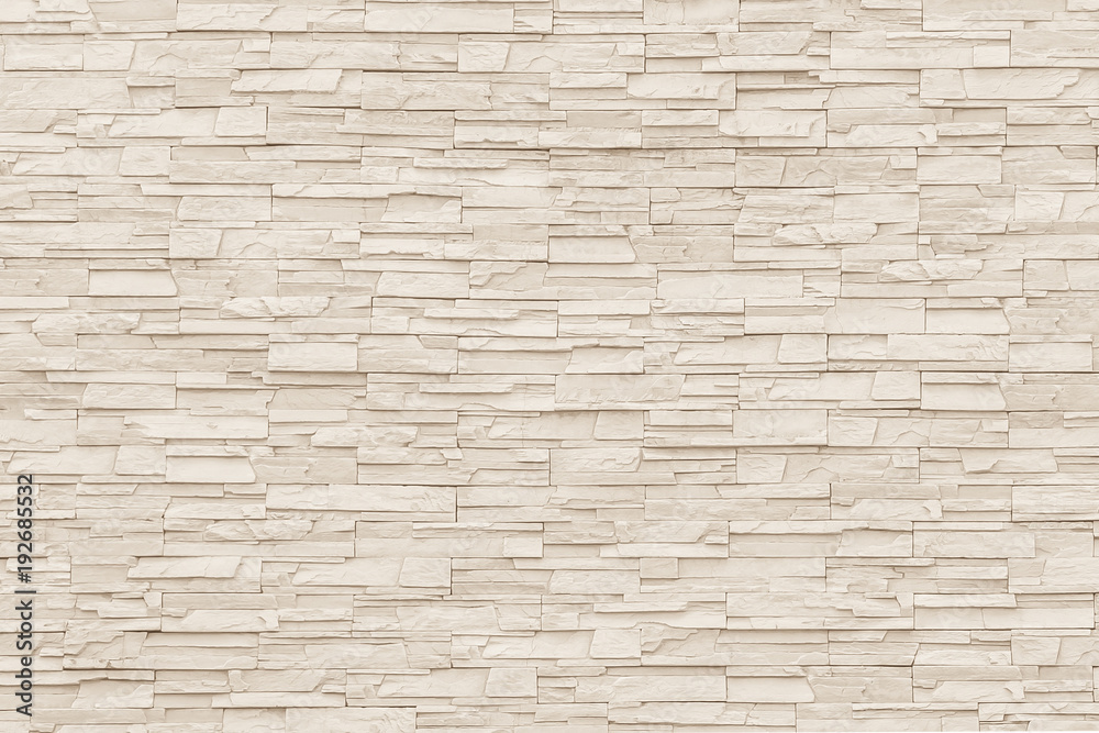Rock stone brick tile wall aged texture detailed pattern background in cream beige brown color - obrazy, fototapety, plakaty 