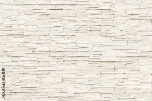 Fototapeta Rock stone brick tile wall aged texture detailed pattern background in cream beige brown color