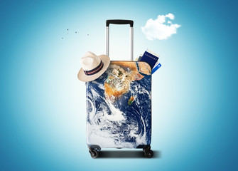 Wall Mural - traveler's bag with a print of the planet earth