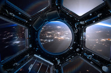 View From A Porthole Of Space Station On The Earth Background. Elements Of This Image Furnished By NASA.