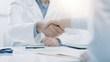 © StockPhotoPro - Doctor and patient shaking hands in the office