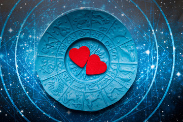Wall Mural - red hearts over blue zodiac like a concept of astrology and love, astrology and relationship