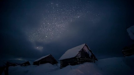 Wall Mural - view at the starry sky and old house on slope. astrophotography.
