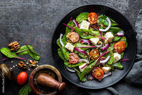 Fotomural plate of nutritious simple salad with chard, walnuts, soft cheese, onions and oi