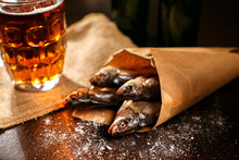 Dried Fish And Vintage Glass Of Beer On A Black Background