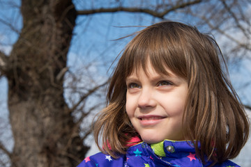 a beautiful girl poses in nature