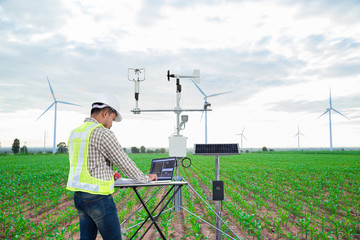 Wall Mural - engineer using tablet computer collect data with meteorological instrument to measure the wind speed