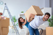 © Elnur - Young family unpacking at new house with boxes