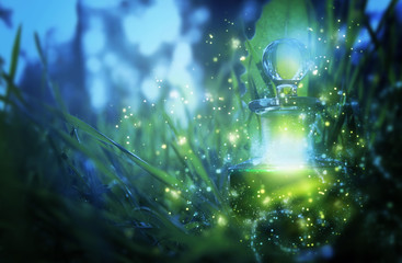 Magical fairy dust potion in bottle in the forest.