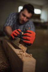 Wall Mural - carpenter works with manual and electric equipment