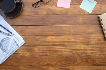 Fototapete - Flat lay of top view desk work table architect with drawing home plan building and stationary on antique brown wood table in home office includes copyspace for add text or graphic