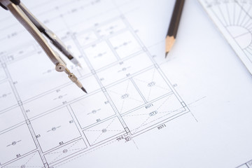 Fototapete - Desk work table architect with drawing home plan building and stationary in home office includes copyspace for add text or graphic