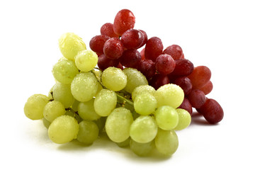 Red and white grapes stock images. Grapes on a white background. Dewy fresh grapes