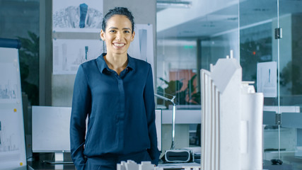 Aufkleber - Female Architectural Designer Works on a Model of a City District with Buildings, Parks and It's Own Ecosystem. She Smiles. Beautiful Woman in Bright Minimalistic Office.