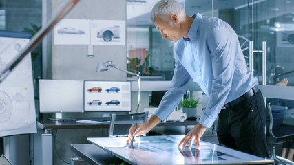 Aufkleber - Experienced Automotive Designer Works With Digital Display Graphics Tablet Touschreen Table, Drawing Sketch of a New Car Prototype.