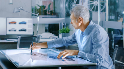 Aufkleber - Experienced Automotive Designer Works With Digital Display Graphics Tablet Touschreen Table, Drawing Sketch of a New Car Prototype.