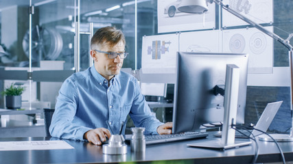 Aufkleber - Experienced Industrial Engineer Working on Personal Computer in the Stylish, Modern, Glass Office.