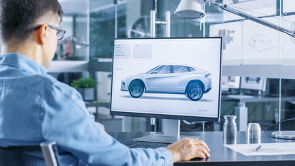 Aufkleber - Automotive Engineer Works on the Personal Computer, He Perfects New Car Model Prototype Sketch. He Works in the Bright and Modern Office.
