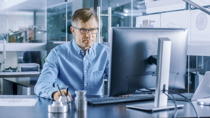 Aufkleber - Experienced Industrial Engineer Working on Personal Computer in the Stylish, Modern, Glass Office.