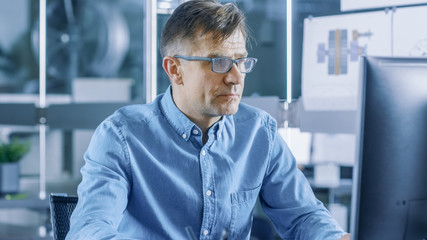 Aufkleber - Chief Industrial Engineer Working on Personal Computer in the Stylish, Modern, Glass Office.