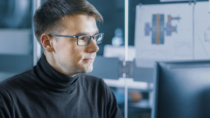 Aufkleber - Young Male Industrial Engineer Works on a Personal Computer. Handsome Smart Man in the Bright Modern Office.