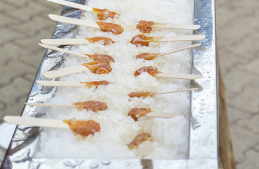 Wall Mural - Hot maple syrup on a stick in the snow