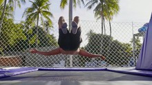 Professional Gymnast Jumping On The Trampoline And Doing Tricks In Air