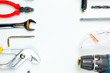 © Goodvibes Photo - Set of construction tools on white background as wrench, hammer, pliers, socket wrench, spanner, tape measure, electric drill,safety glasses, screwdriver