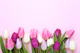 Fototapeta Tulipany - Bouquet of tulips on pink background