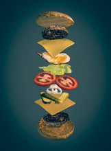 Image Shows An Exploded View Of A Burger Decorated With Toppings Like Fried Egg, Lettuce, Cheese, Patty, Onions
