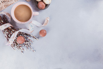 Wall Mural - Pink coffee mug with sweet pastel french macaroons and pussy willow