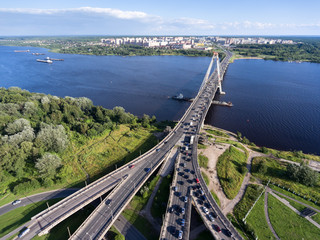 Wall Mural - Traffic jam is on the Octyabrsky suspension bridge across the Sheksna river in Cherepovets, Vologda region, Russia