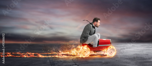 Cuadros en Lienzo Fast businessman with a car wins against the competitors