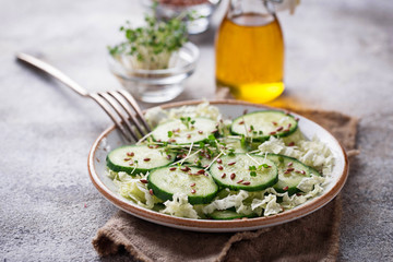 Wall Mural - Healthy spring salad with cucumber, flax seed and cress 