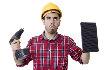 construction worker with thoughtful expression, with drill and tools