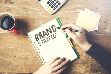 woman written brand strategy text