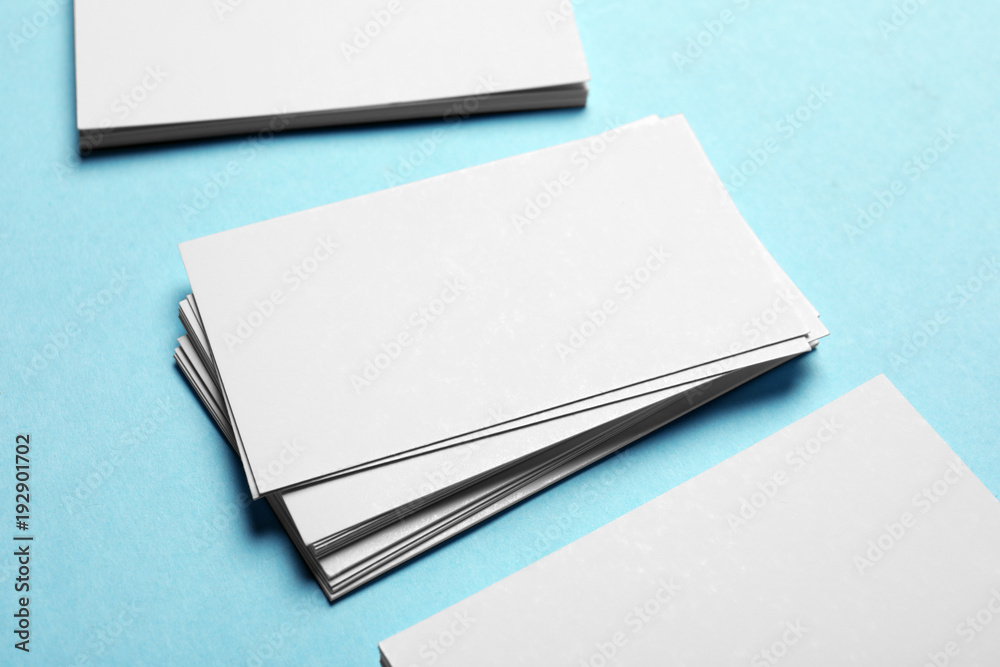Blank business cards on color background