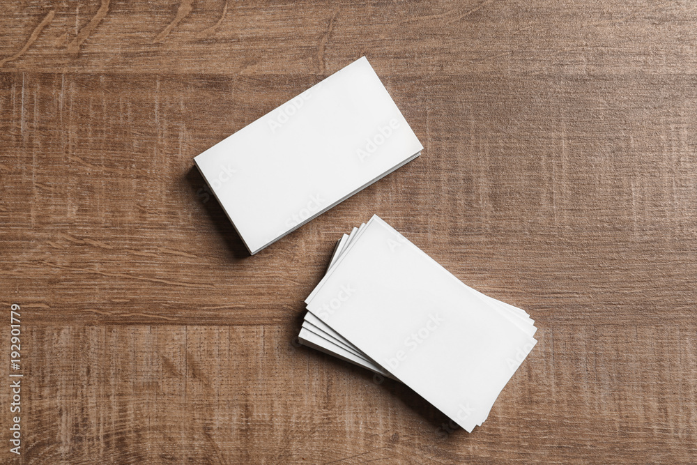 Blank business cards on wooden background