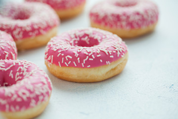 Donut. Sweet icing sugar food. Dessert colorful snack. Glazed sprinkles. Treat from delicious pastry breakfast. Bakery cake. Doughnut with frosting. Baked unhealthy round