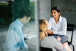 © Danon - A young and attractive Indian Asian woman is interviewing for a job. She is dressed professionally in a white shirt and is sitting and talking to her interviewers. She is confident and relaxed