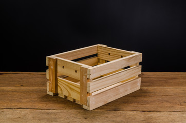 empty wooden crate on wooden board background