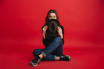 Wall Mural - Portrait of a pretty stylish girl wearing hat posing