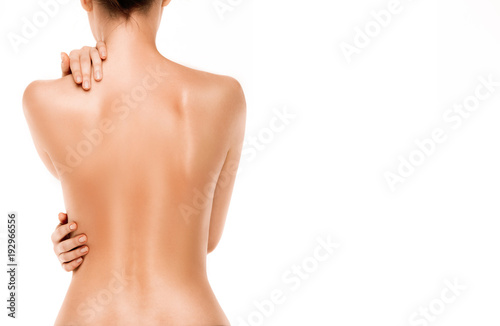 Cuadros en Lienzo Naked back of a woman, isolated on white background