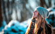© leszekglasner - Young woman in the winter park at sunny day, warm clothes