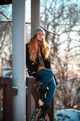 Wall Mural - Happy winter time, smiling young woman in the park